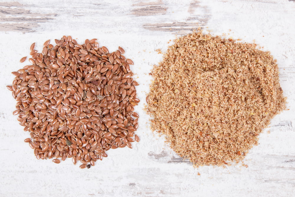 Flaxseed and ground flaxseed on table